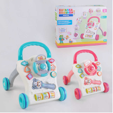 Музичні ходунки-каталка 61925 (12/2) “TK Group“, 2 кольори, ОЗВУЧ. УКР. МОВОЮ, тріскачка, проектор, 3D підсвіч., 3 пісні, мелодії, сортер, у коробці
