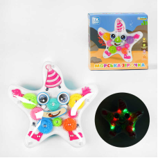 Музична іграшка “Морська зірочка“ TK - 21203 (48) “TK Group“, ОЗВУЧУВАННЯ УКРАЇНСЬКОЮ МОВОЮ, підсвічування, колесо вільного ходу, рухомі шестерні, в коробці