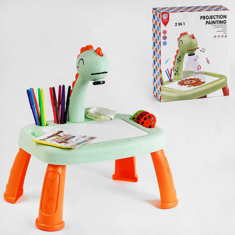 Столик з проєктором YM 2220 (24/2) “Динозаврик“, підсвічування, мелодія, 3 диски, альбом, 12 фломастерів, в коорбці