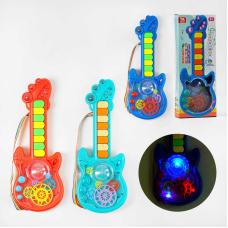 Гітара на батарейках TK - 14702 (48) “TK Group“, 3 кольори, ОЗВУЧУВАННЯ УКРАЇНСЬКОЮ МОВОЮ, 2 режими гри, 8 пісень, піаніно, прозорий корпус, рухомі шестерні, в коробці, МІКС