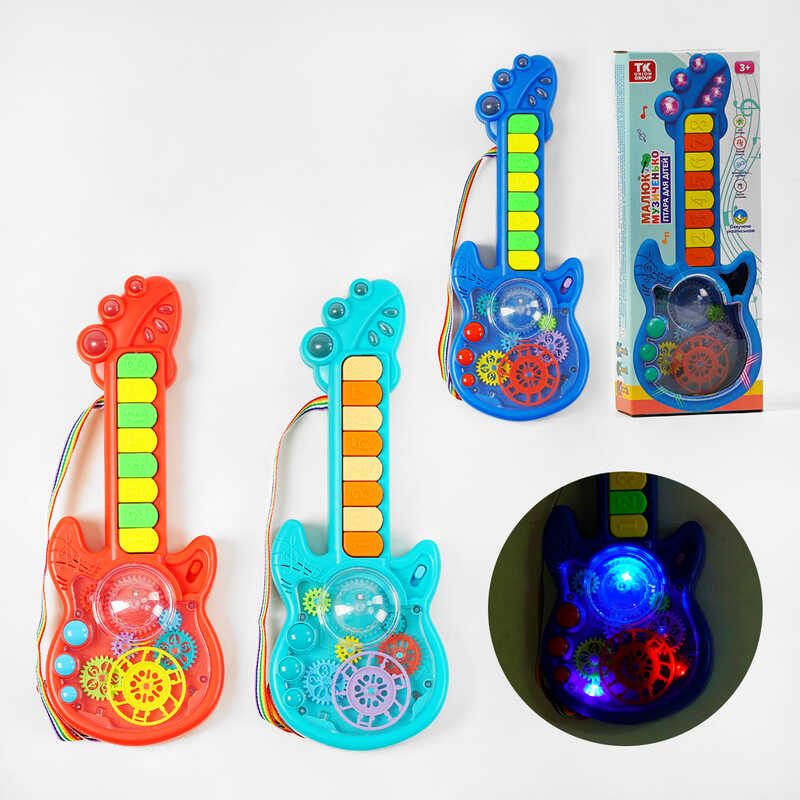 Гітара на батарейках TK - 14702 (48) “TK Group“, 3 кольори, ОЗВУЧУВАННЯ УКРАЇНСЬКОЮ МОВОЮ, 2 режими гри, 8 пісень, піаніно, прозорий корпус, рухомі шестерні, в коробці, МІКС Гітара на батарейках TK - 14702 (48) “TK Group“, 3 кольори, ОЗВУЧУВАННЯ УКРАЇНСЬКОЮ МОВОЮ, 2 режими гри, 8 пісень, піаніно, прозорий корпус, рухомі шестерні, в коробці, МІКС